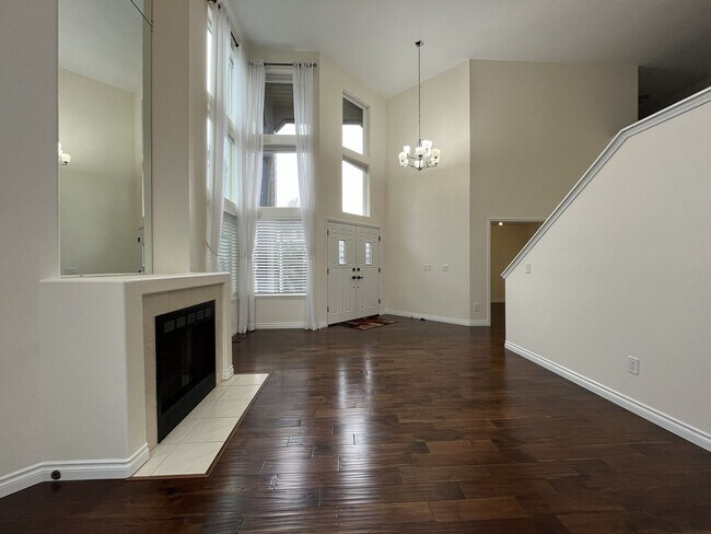 Building Photo - Grand 5 Bedroom Home Featuring 19ft Ceilings, Family Room & Main-Level Suite