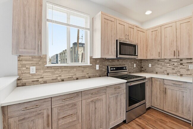 Building Photo - $2,890.95, 2-bed, 2.5-bath, located in Denver with a rooftop terrace.