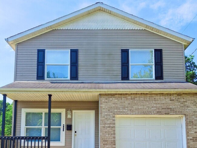 Building Photo - 4 Bed / 2 Full Bath House with Brand-New Kitchen, Attached Garage, and Full Basement - Built 2001
