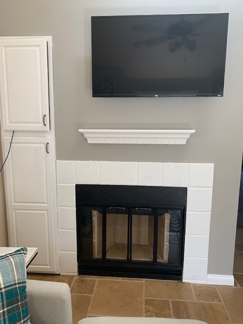 Fireplace and built in cabinets featured in living room - 2600 Brookside Dr