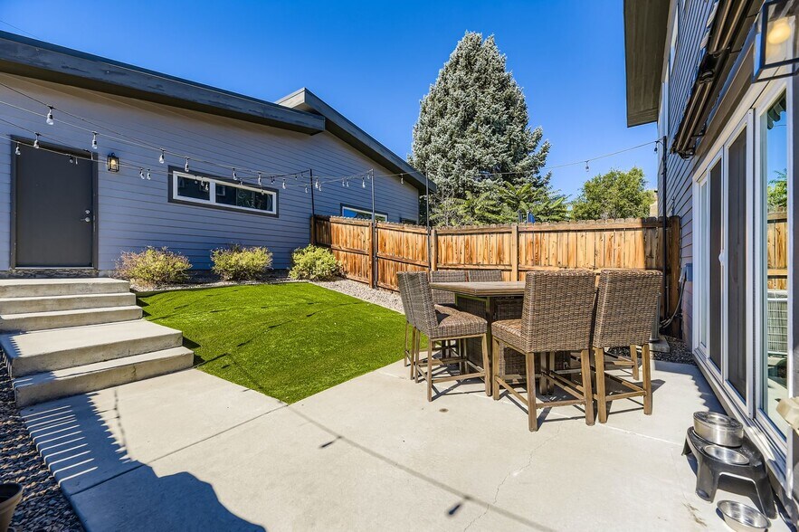 Enclosed back yard w/bistro lights & artificial turf - 1197 S Mariposa St