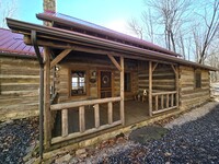 Building Photo - Beautifully Furnished Log Cabin in Paved S...