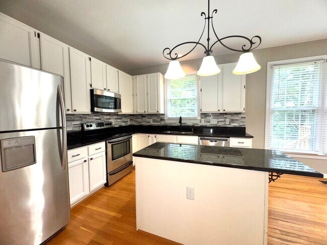 Building Photo - Spacious 4BR 2.5BA Home in Adams Farm with...