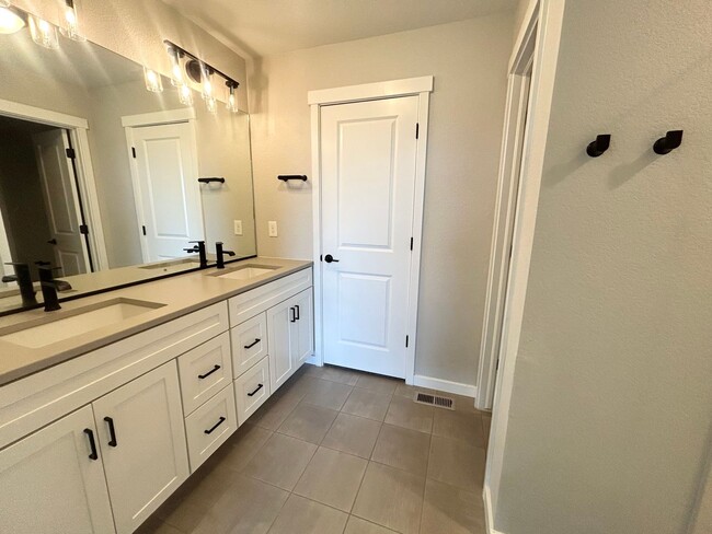 Building Photo - Impressive 4 Bedroom Townhome Nestled in M...