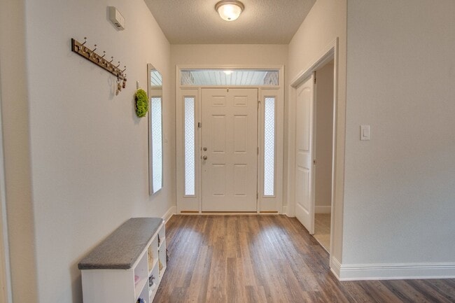 Building Photo - Spacious 4BR/2BA Brick Home with 2-Car Garage, Granite Kitchen, Vaulted Ceilings & Fully Fenced B...