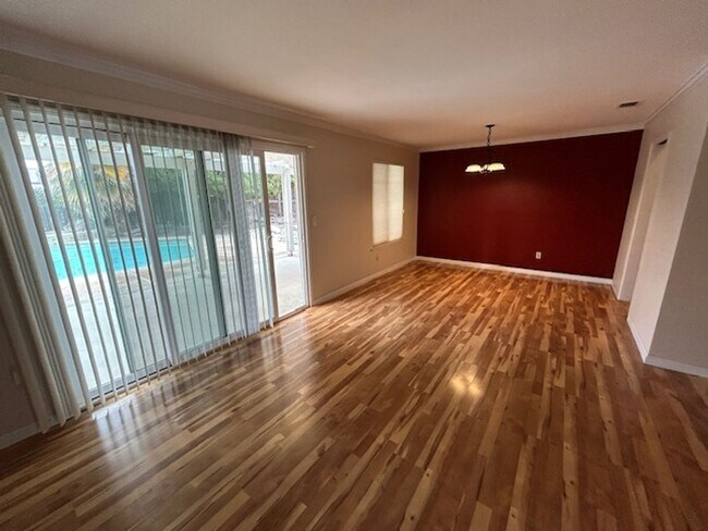 Building Photo - SW 3 Bedroom 2 Bath home with Pool. Yard Care Included.