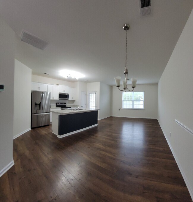 Building Photo - "Modern 3-Bedroom Multiplex with 3 Full Ba...