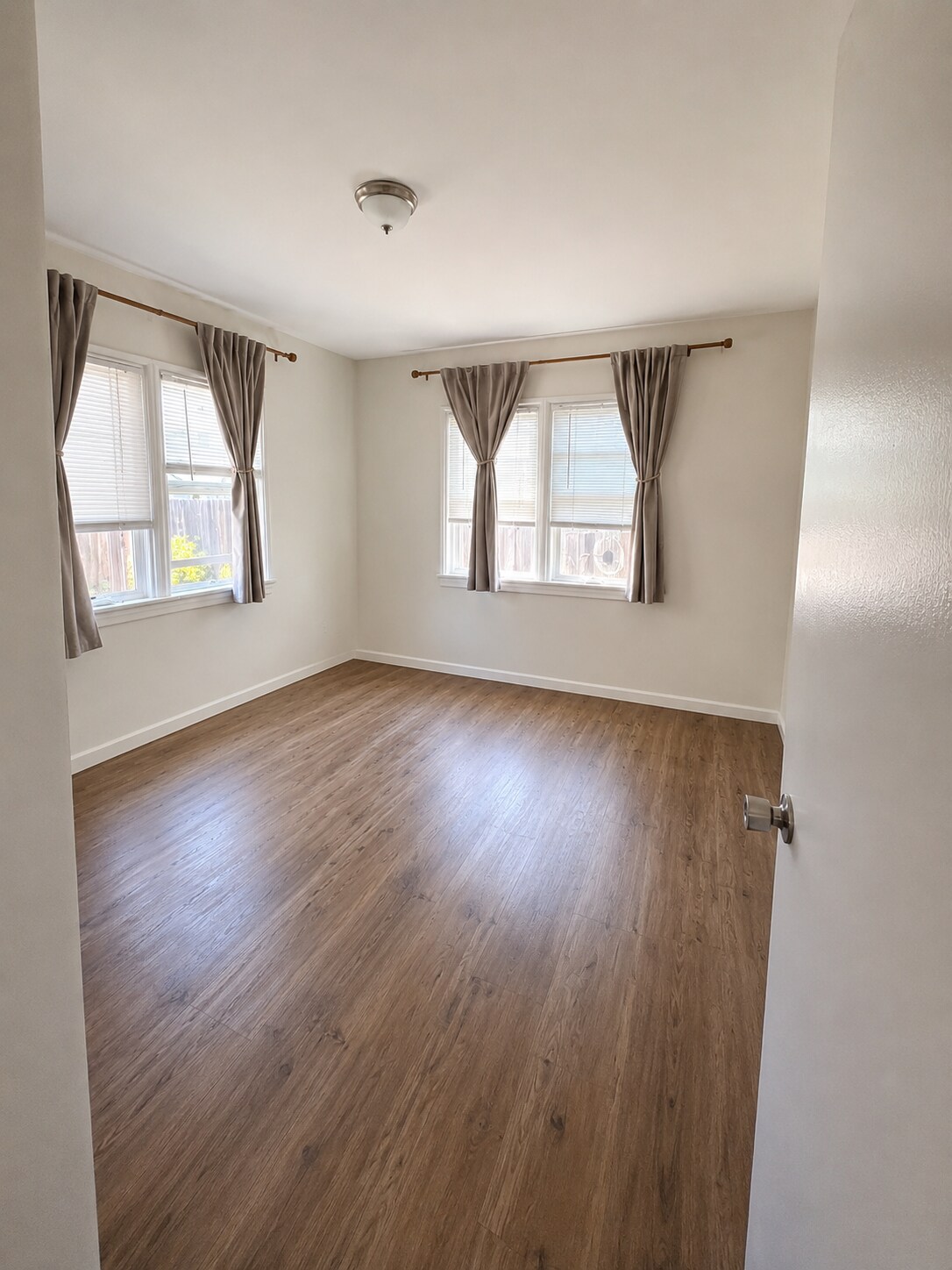 bedroom with new double pane windows - 4091 Rosecrans Ave