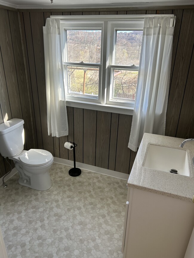 Bathroom: New Vanity and Vanity w/ New Plumbing. New Flooring. Newer Toilet. - 126 Continental Ave