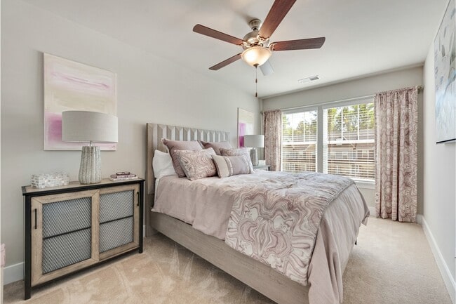 Bedroom with Plush Carpeting and Ceiling Fan with Light - Covey Homes Addison