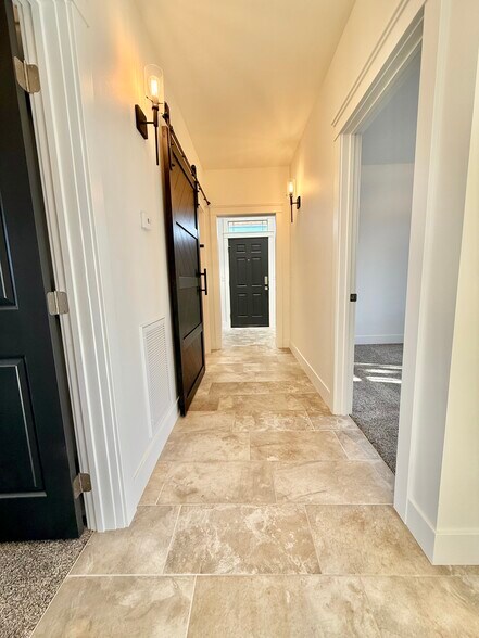 View from kitchen through hall to back alley entry door - 24 Ash St N