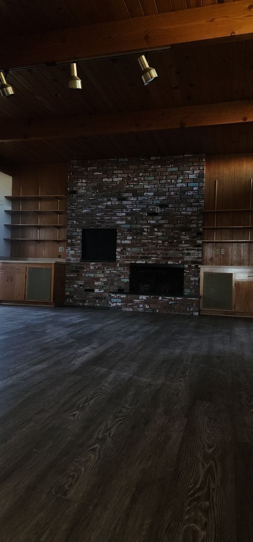 Building Photo - This is a spacious house featuring four bedrooms and two bathrooms, along with a two-car garage.