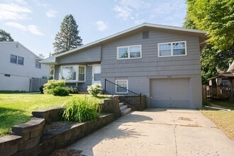 Building Photo - Beautiful multi-level with Gorgeous Yard and LOTS of Storage!