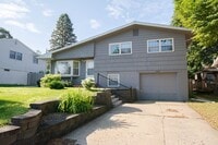 Building Photo - Beautiful multi-level with Gorgeous Yard and LOTS of Storage!