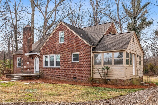 Building Photo - SW, Large Brick Two Bedroom PLUS Two Sun-Rooms, Hardwoods, LR & Separate DR, Fire Place!