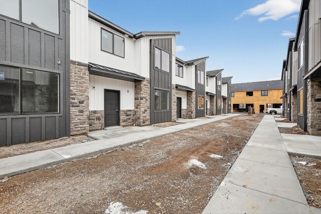 Building Photo - $500 off first month - BRAND NEW 3 BED 2.5 BATH TOWNHOMES WITH 2 CAR GARAGE