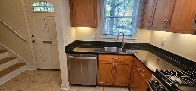 Building Photo - Spacious 2-bedroom townhouse on beautifully landscaped grounds.