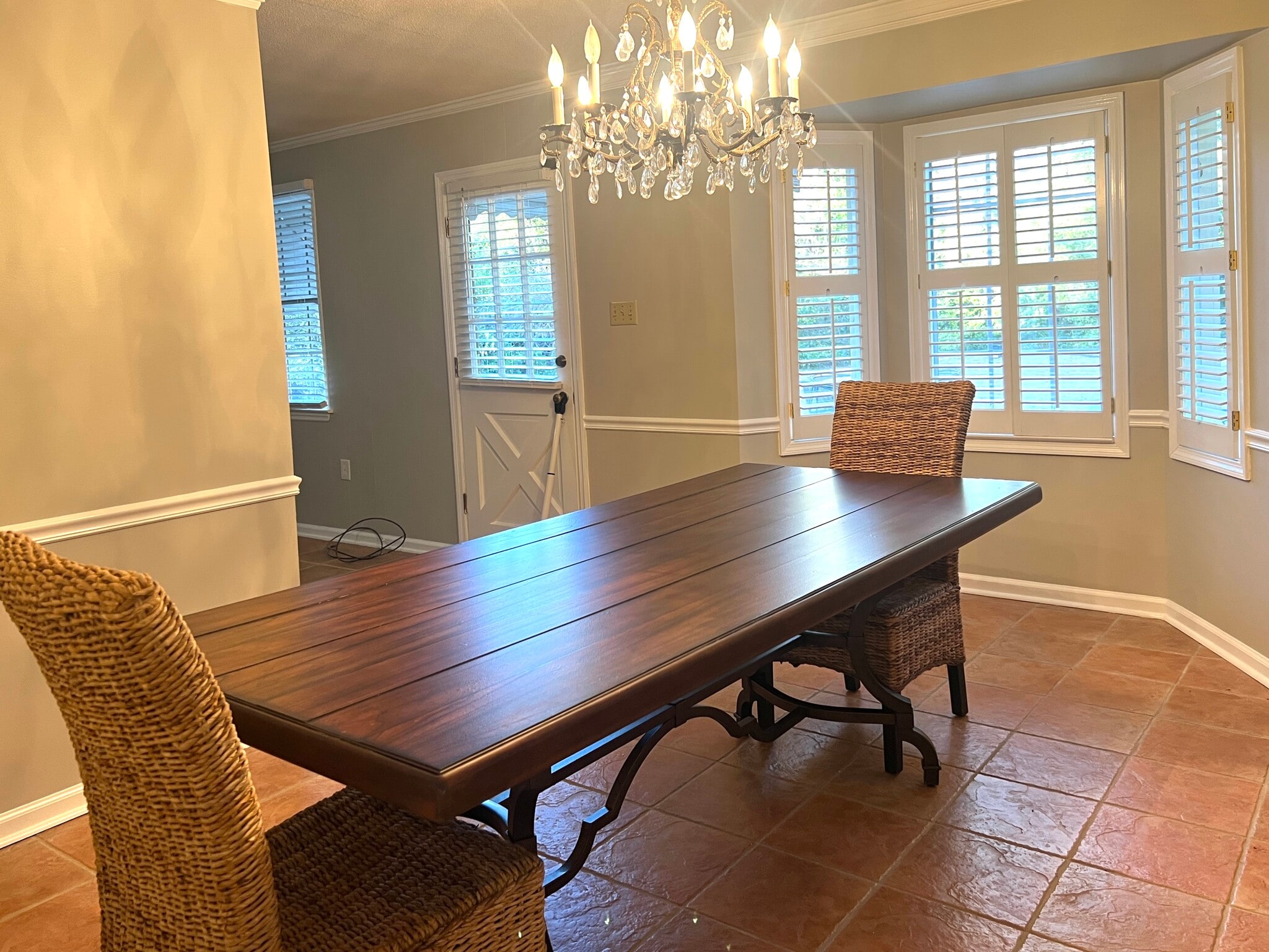 The large table and chairs in the formal dining area - 902 Penn Waller Rd