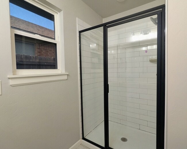 Building Photo - Spacious Yukon Home with Storm Shelter, 2-Car Garage & Fenced Yard!