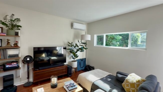 Bright living room with new mini-split A/C & heat - 4360 Stewart Ave
