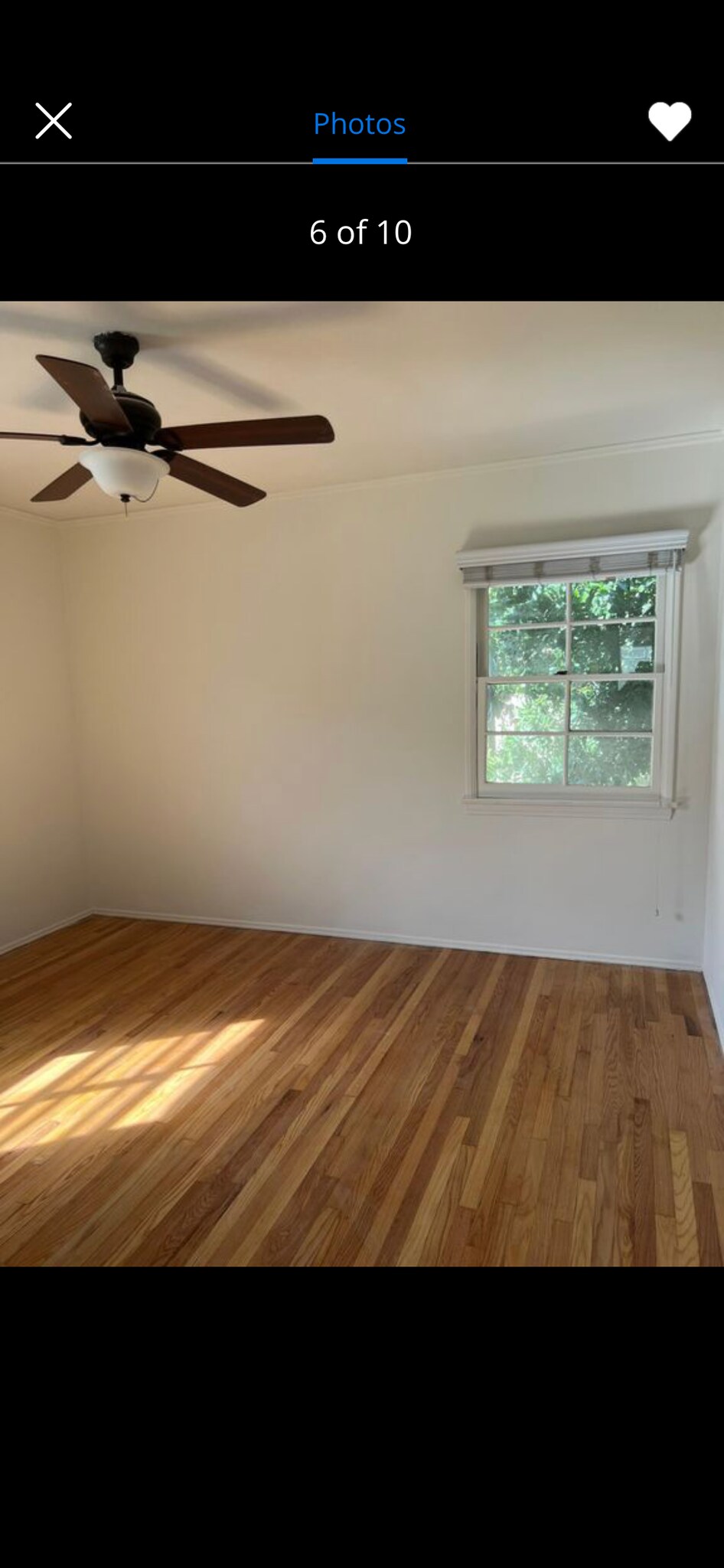 Both bedrooms feature wood floors and ceiling fans. - 4411 Ensign Ave
