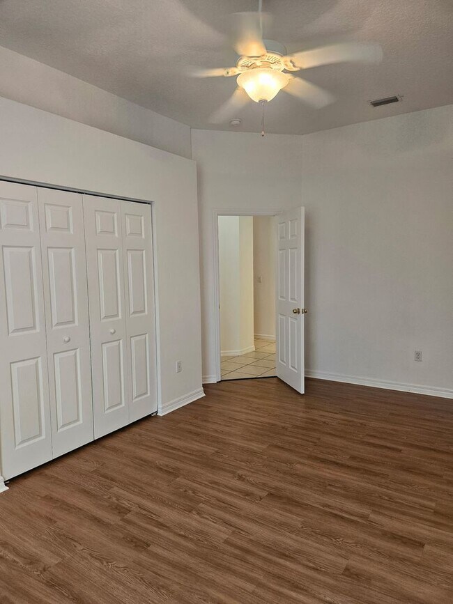 Building Photo - 4 BEDROOM 3 FULL BATH HOME WITH A SCREENED IN POOL IN THE BEAUTIFUL PALM COAST