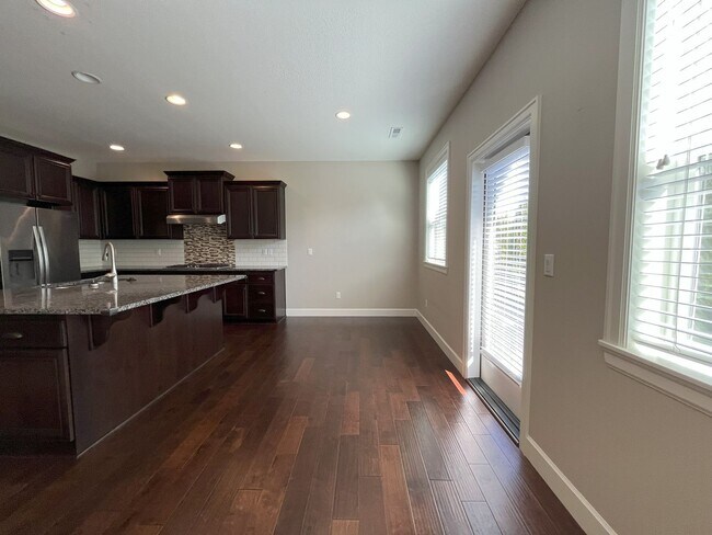Building Photo - Spacious 4-Bedroom + Bonus Room with Modern Kitchen, Solar Panels & Private Fenced Backyard!