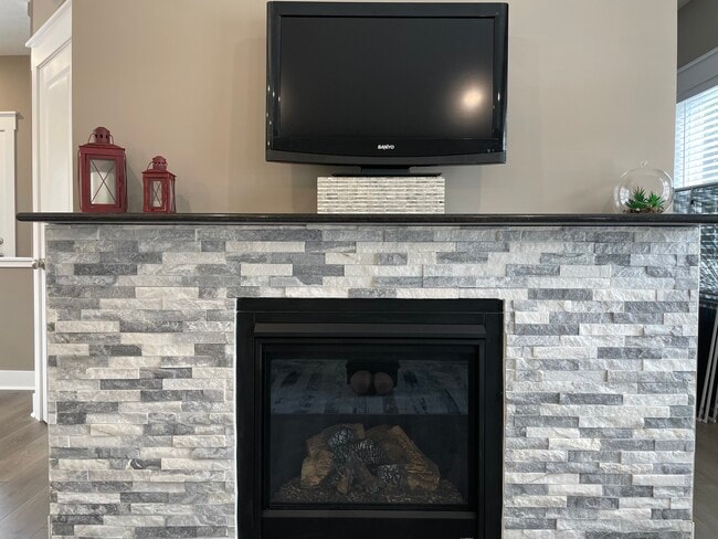 Stone Fireplace with Granite Mantel - 1730 Chief Okemos Cir