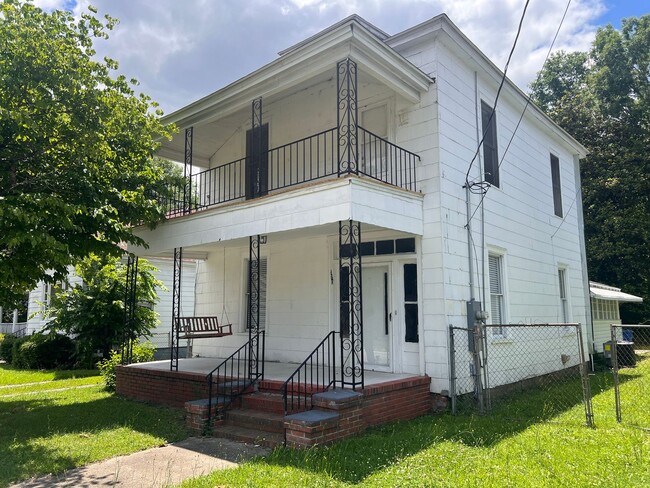 Primary Photo - Four Bedroom One & Half Baths House