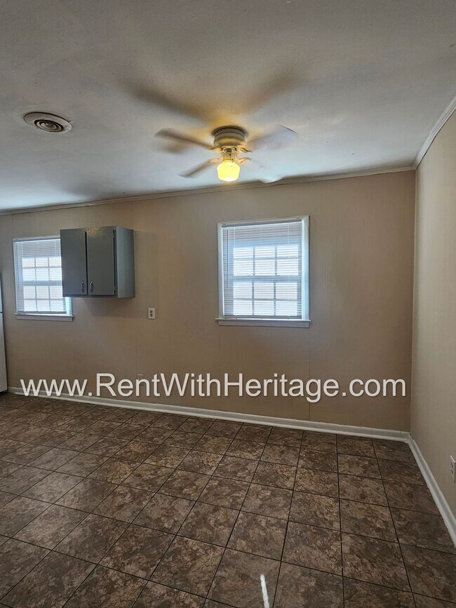 Building Photo - Great Brick Ranch / Harwood Floors / Huge Shop or Extra Storage / No Garage / Great Private Back ...