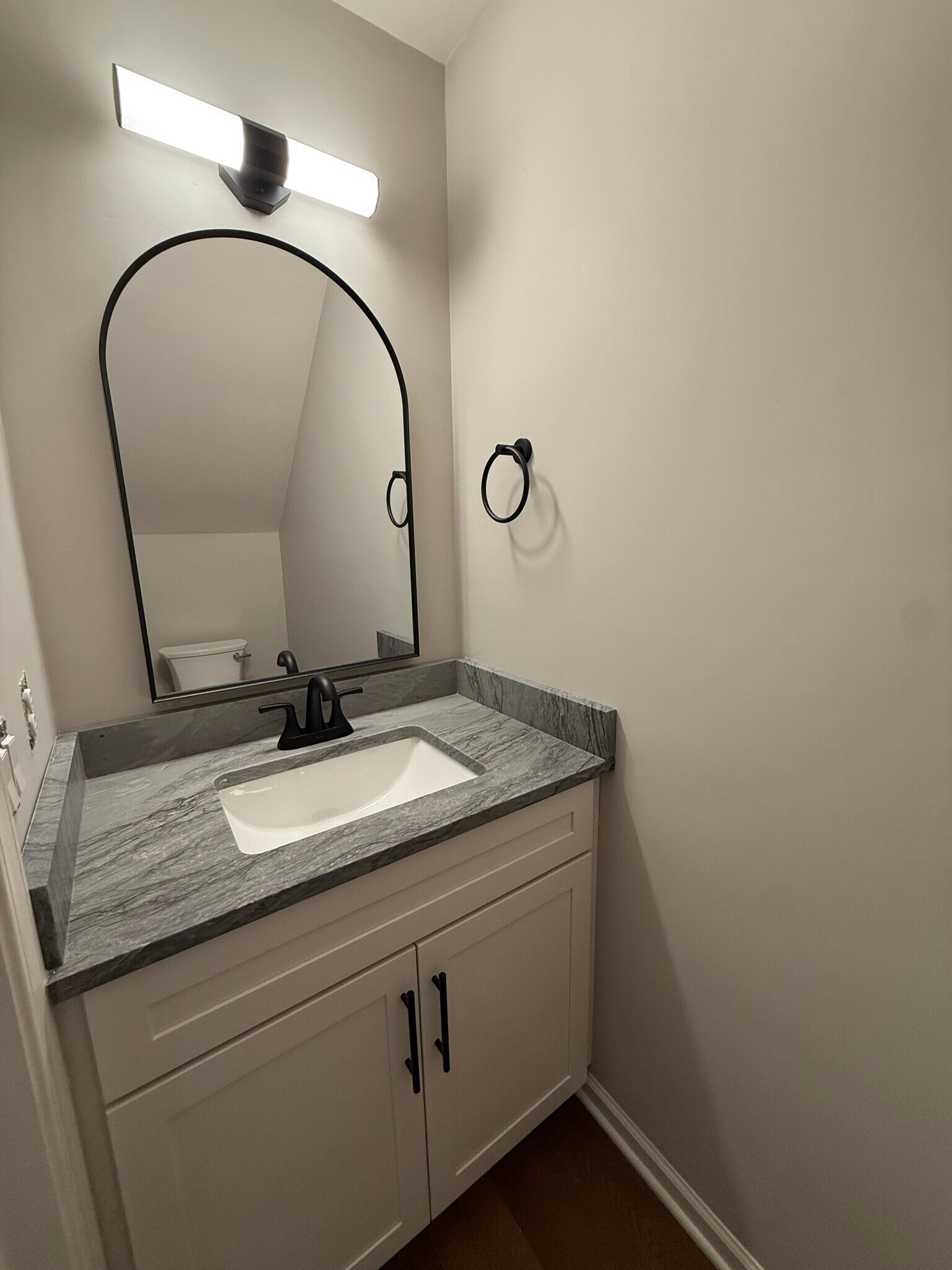 1/2 bath with new vanity and quartzite countertop - 6617 Rothchild Dr