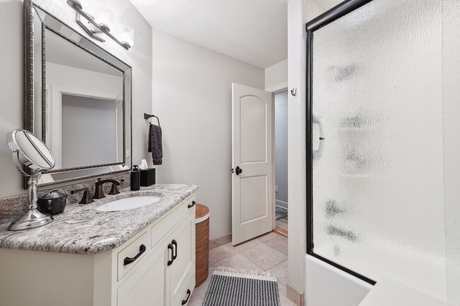 Hallway bath is full size offering tub/shower combo - 245 Inland Ln N