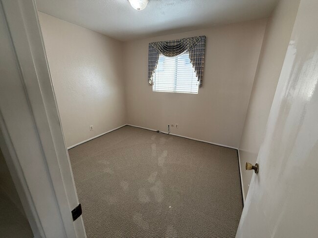 Third bedroom — ideal for a child’s room, guest room, or home office. - 1134 W Huntington Dr