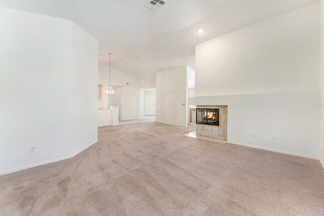 Building Photo - Vaulted Ceilings, Cozy Fireplace & Desirable Single-Story Living Near The Lakes!