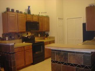 Fully equipped kitchen with pantry and laundry room - 6111 Maggies Cir