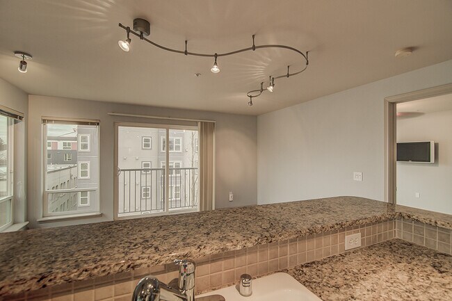 Building Photo - Top floor corner one-bedroom in the heart of it all, don't miss out, tour today!
