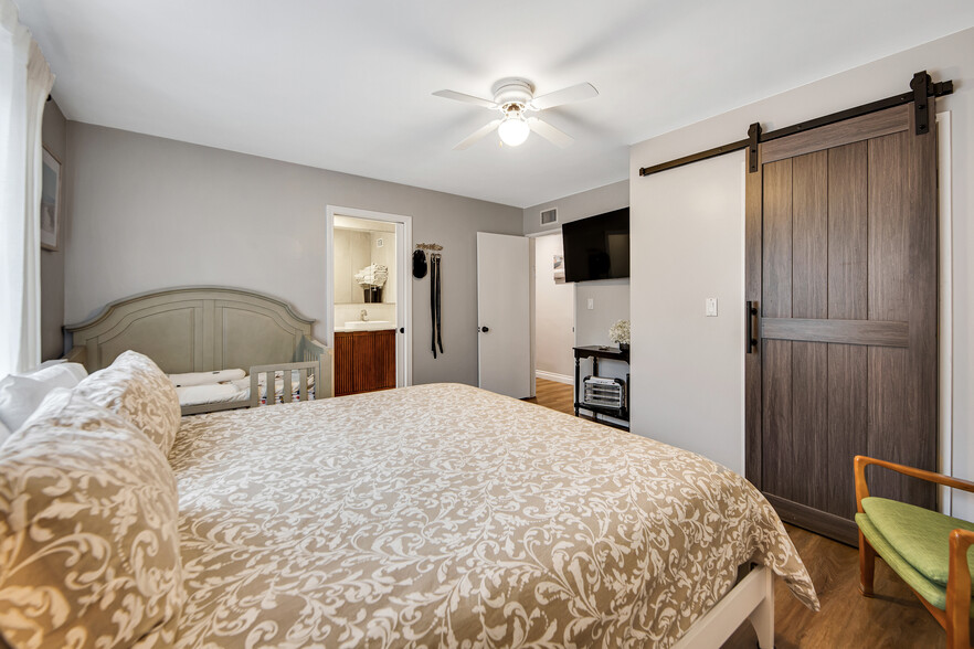 Walk-in closet w/ wood door & professional organizers - 6908 Royer Ave