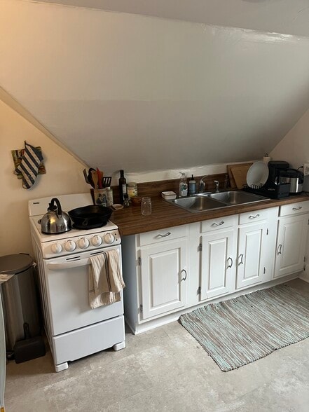 Kitchen - view from in the center of the room. - 114 Buell St