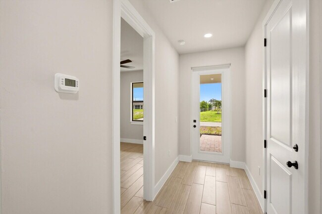 Building Photo - New Construction 3/2 Pool Home on Canal, $2,699, NW Cape Coral. The Only Thing Used Here Is the W...