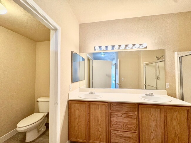 Building Photo - DOWNSTAIRS CONDO | GATED COMMUNITY | CENTENNIAL HILLS | UPDATED 3 BEDROOM