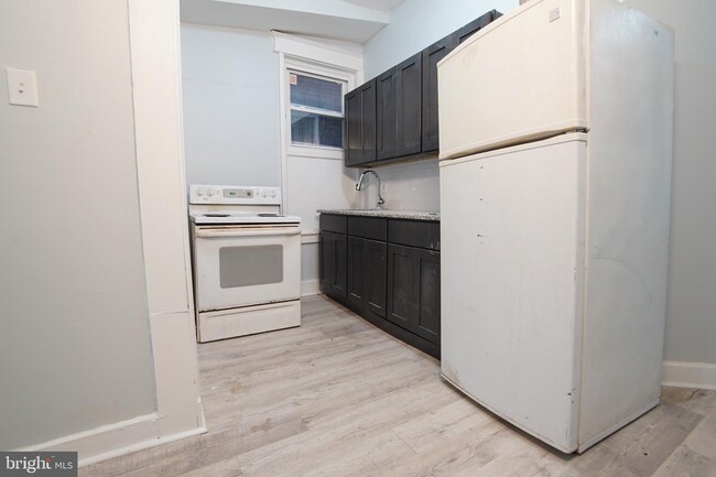 Building Photo - 7022 Woodland Ave