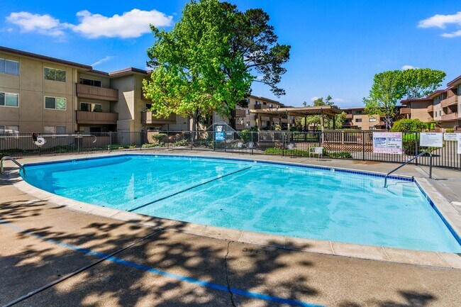 Building Photo - Modern 2-Bedroom Condo with Pool and Koi Pond Views