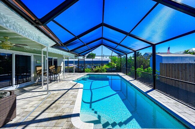 Building Photo - Waterfront Furnished Pool Home with Gulf & Canal Views in Estero Bay Shores