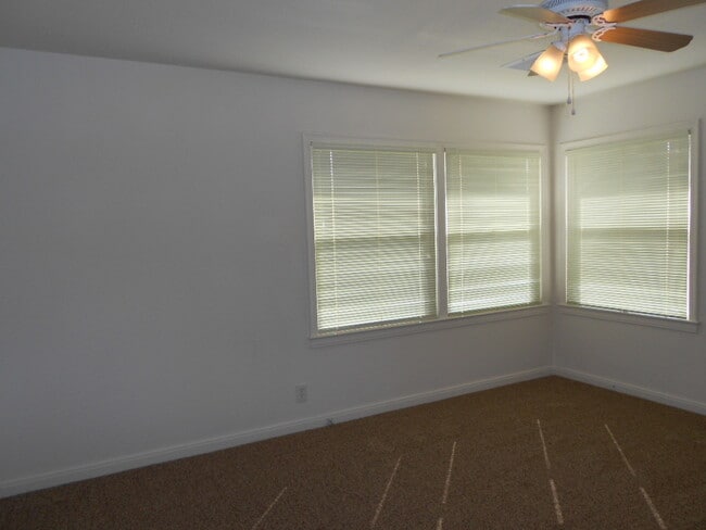Building Photo - Central North home with big backyard, dual pane windows & more!