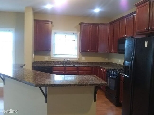 Building Photo - 2 br, 2 bath Condo - 4953 Oakton 208 Unit 208