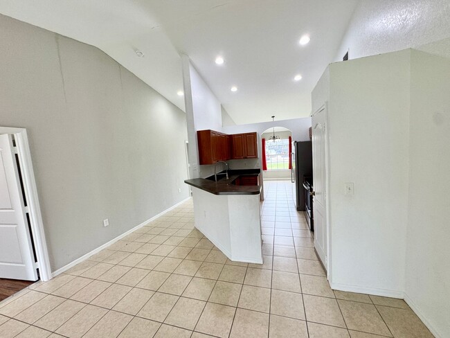 Building Photo - 4 Bedroom 2 Bath Home in Poinciana Village 3