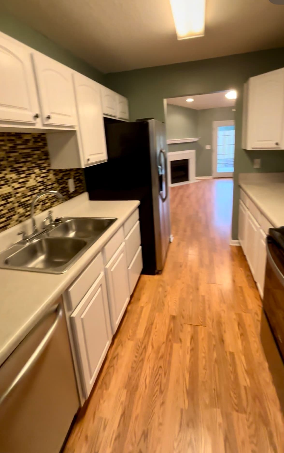 looking from dining room through kitchen - 1208 Apex Ln