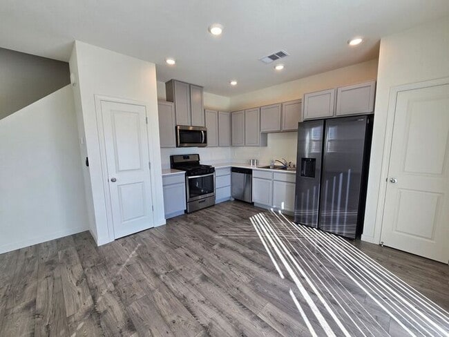 Building Photo - Modern 3-Bedroom Townhome with 2-Car Garage, Bright Interiors & Private Patio