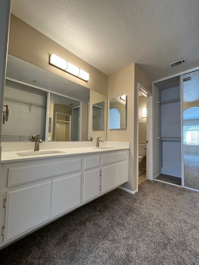 Building Photo - PICTURE PERFECT!  3 BR/3 BA END UNIT CONDO with DIRECT ACCESS 2 CAR GARAGE