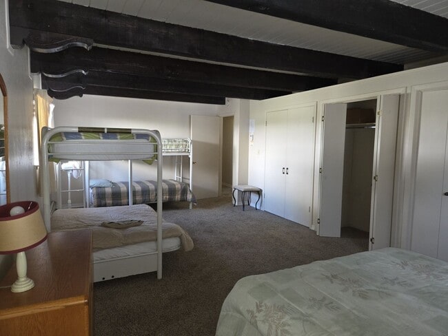 Building Photo - Unique open design,wood beams in all rooms-Very cheery and cozy. Newly remodeled, and newly furni...